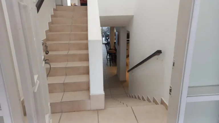Interior curved staircase in a modern beachfront home