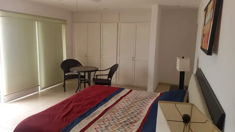 Master bedroom with ocean view in a beachfront home